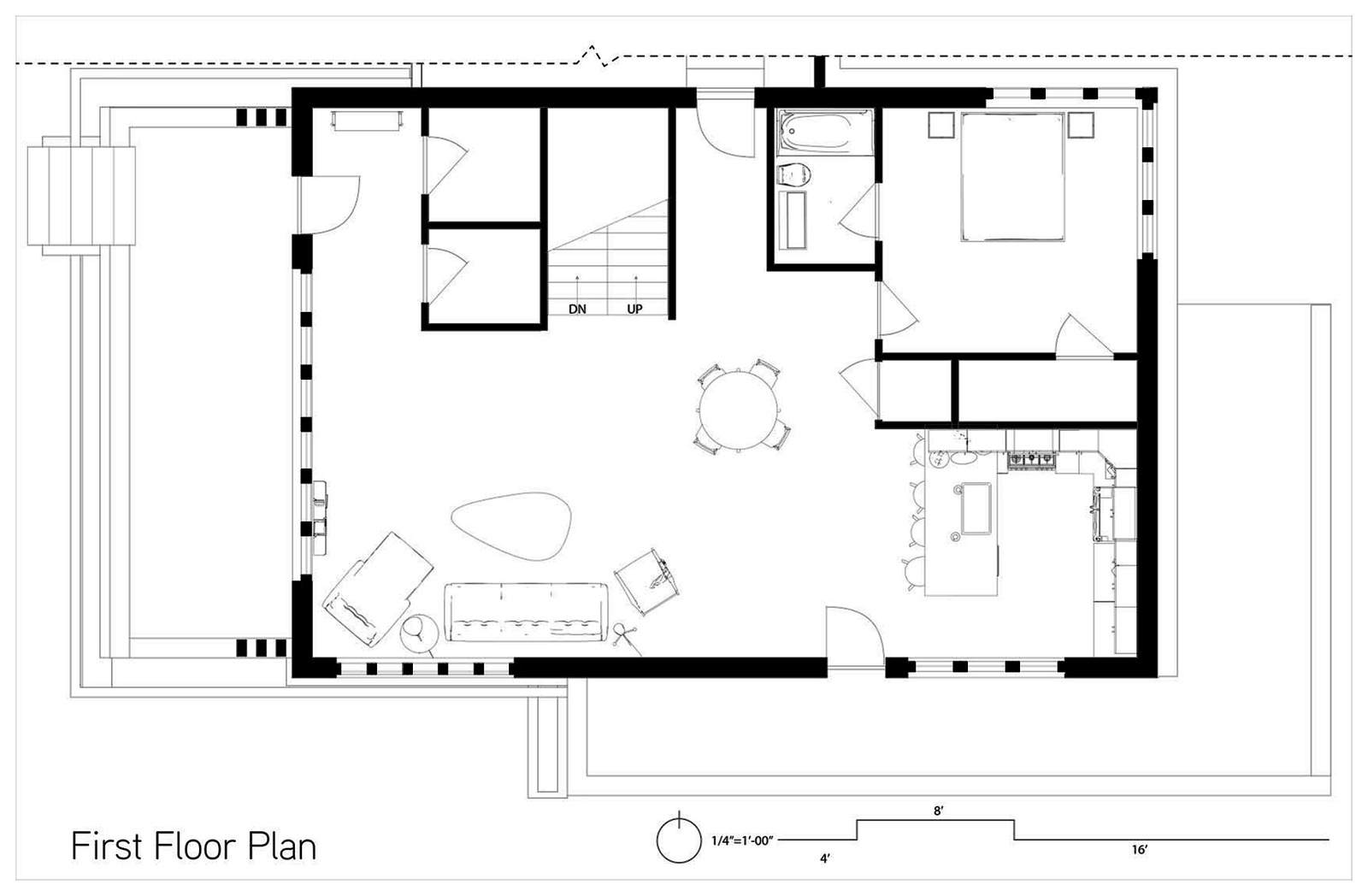 First floor plan. Living, dining, kitchen, primary bedroom and bath, stair to the second floor.